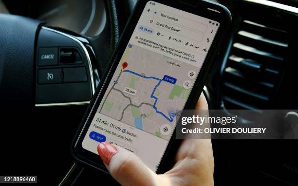 This illustration picture shows Google map application displaying medical facility or a COVID-19 testing center on a smartphone in Arlington,...