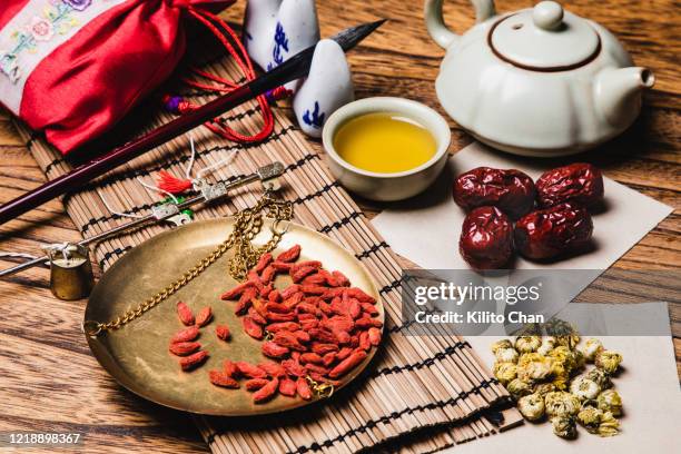 variety of traditional chinese medicine on the wooden desk - azufaifo fotografías e imágenes de stock