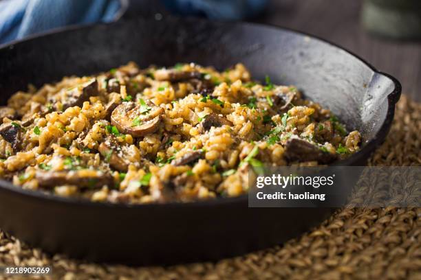 healthy vegan mushroom risotto - green mushroom stock pictures, royalty-free photos & images