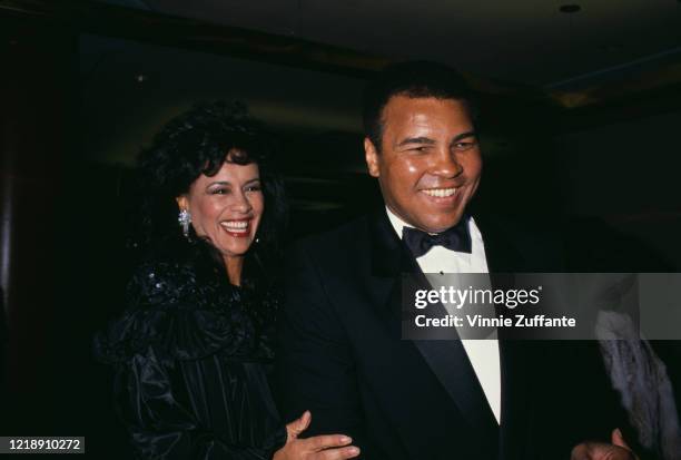 American psychologist Veronica Porche Ali and her husband, American heavyweight boxer Muhammad Ali , wearing a tuxedo to an event, circa 1985.