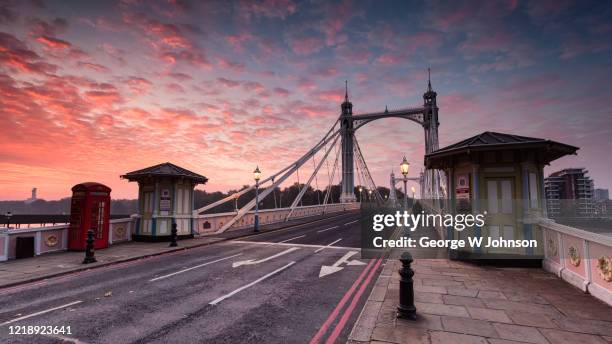 red sky bridge - embankment stock pictures, royalty-free photos & images