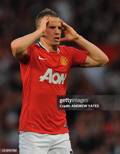 Manchester United's English midfielder Tom Cleverley reacts during the English Premier League football match between Manchester United and Tottenham...