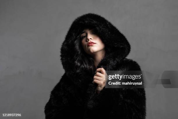 black fur hood - fur coat stock pictures, royalty-free photos & images