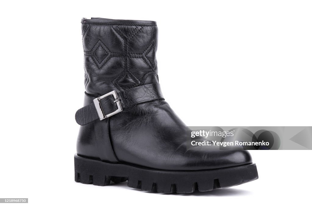 Black leather boot isolated on white background