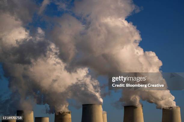 vapour from a lignite power plant - burning coal stock pictures, royalty-free photos & images