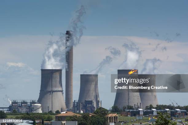 vapour rises from cooling towers - coal wind stockfoto's en -beelden