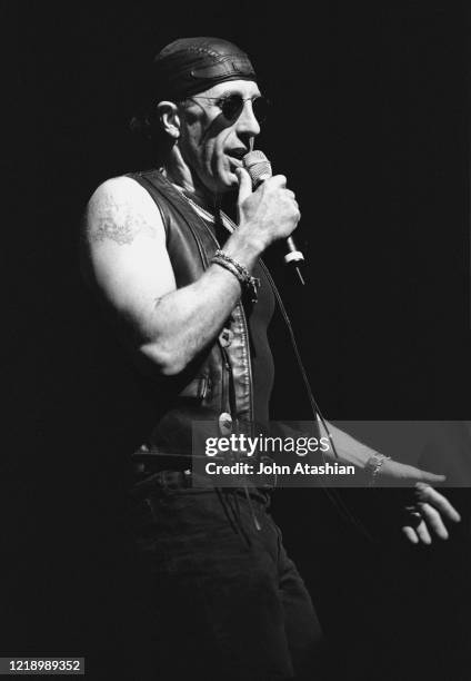 Singer, radio personality, and actor Dee Snider is shown on stage making an introduction of a band on July 23,1992.