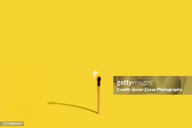 burning matchstick - matchstick stock pictures, royalty-free photos & images