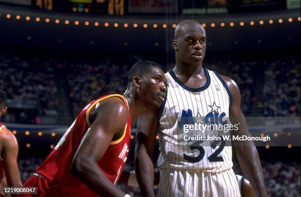 Finals: Orlando Magic Shaquille O'Neal with Houston Rockets Hakeem Olajuwon during game at Orlando Arena. Game 2. Orlando, FL 6/9/1995 CREDIT: John...