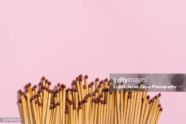 matches on pink - burning match stock pictures, royalty-free photos & images