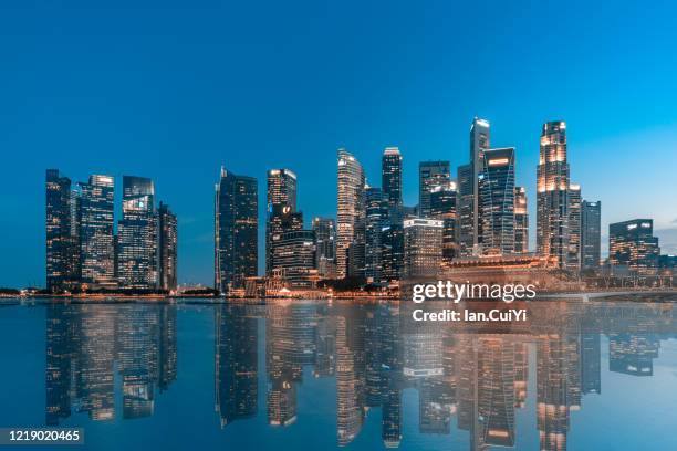 skyscrapers in singapore (dusk) - singapore night stock pictures, royalty-free photos & images