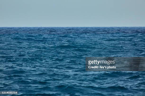 sea floor stock photo. smooth pacific ocean with blue color. - océano pacífico fotografías e imágenes de stock