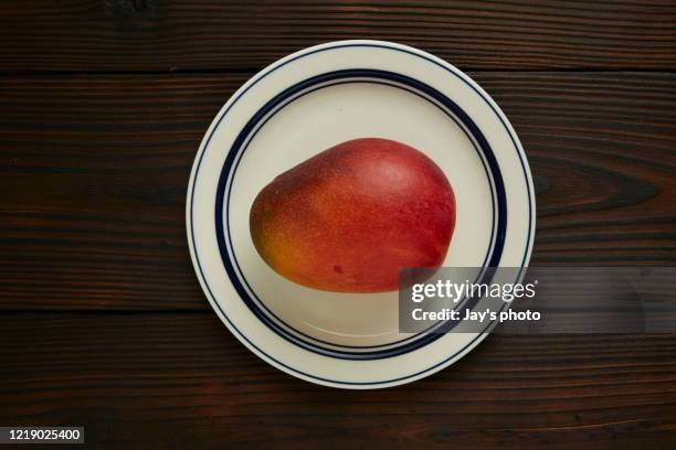 mango slice on plate background. - mango slice on white stock pictures, royalty-free photos & images