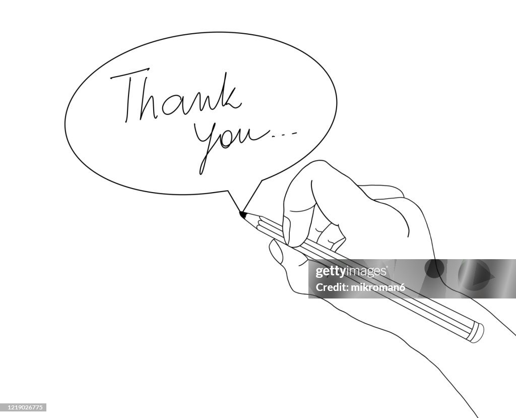 Hand Holding a pencil drawing a speech bobble with text THANK YOU