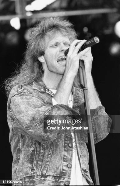 Singer and songwriter Henry Lee Summer is shown performing on stage during a "live" concert appearance on June 24, 1989.