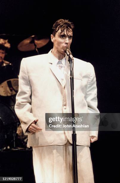 Singer, songwriter and guitarist David Byrne is shown wearing his oversized suit during a "live" concert appearance with the Talking Heads on August...