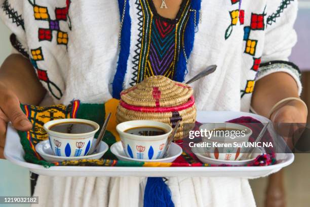 amhara people offering coffee ceremony - ethiopia coffee bildbanksfoton och bilder