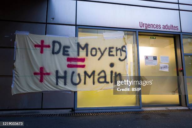 Picket sign of demands by striking ER staff at Tenon Hospital in Paris.
