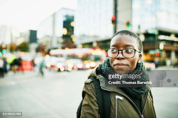 portrait of businesswoman on street while commuting to work - real people stock pictures, royalty-free photos & images