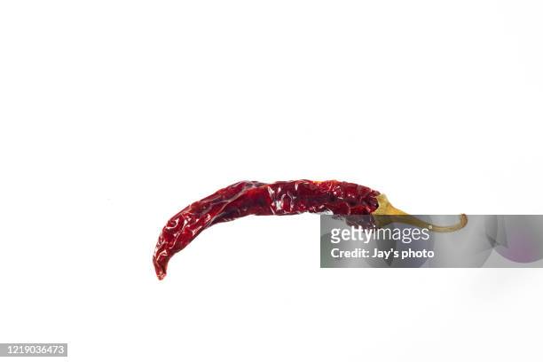 dried hot chili pepper. red color. - chili freisteller stock-fotos und bilder