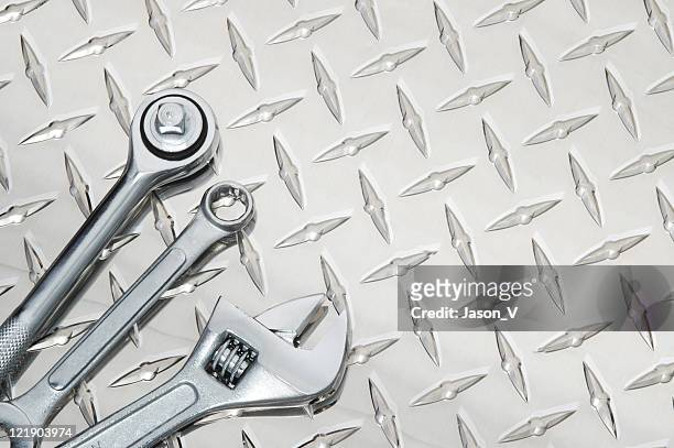 tools on steel - diamond plate stock pictures, royalty-free photos & images