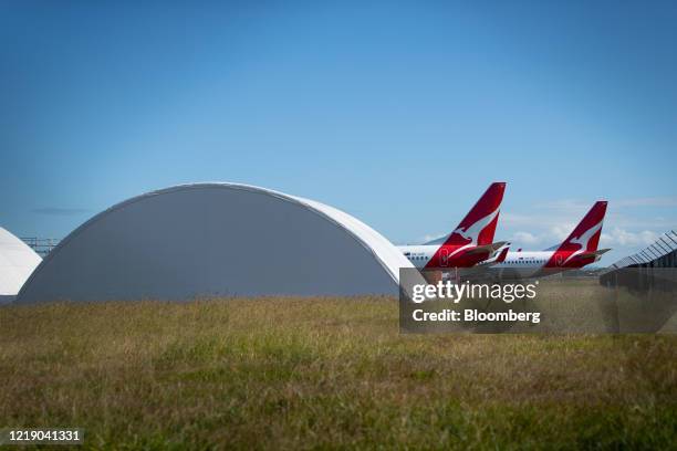 Grounded Qantas Airways Ltd. Aircraft stand outside hangars at Brisbane Airport in Brisbane, Australia, on Tuesday, June 9, 2020. Coronavirus-related...