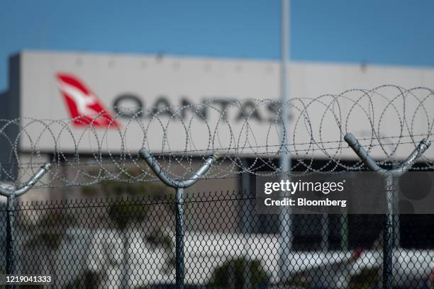 Qantas Airways Ltd. Aircraft hangar stands behind security fencing at Brisbane airport in Brisbane, Australia, on Tuesday, June 9, 2020....