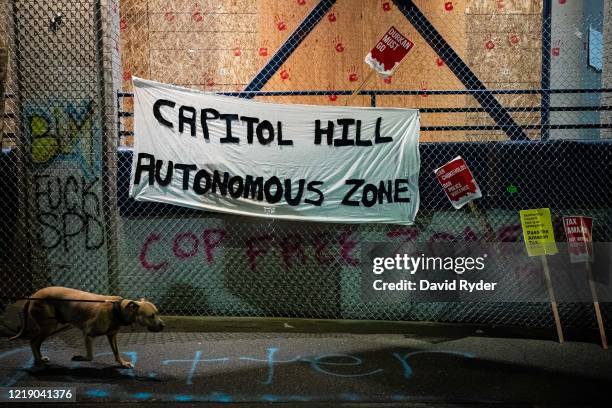 Capitol Hill Autonomous Zone" sign hangs on the exterior of the Seattle Police Departments East Precinct on June 9, 2020 in Seattle, Washington....