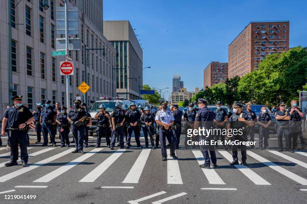Blocking the entrance to the Brooklyn Bridge. Thousands of New Yorkers joined by religious leaders and elected officials gathered at Brooklyn Borough...