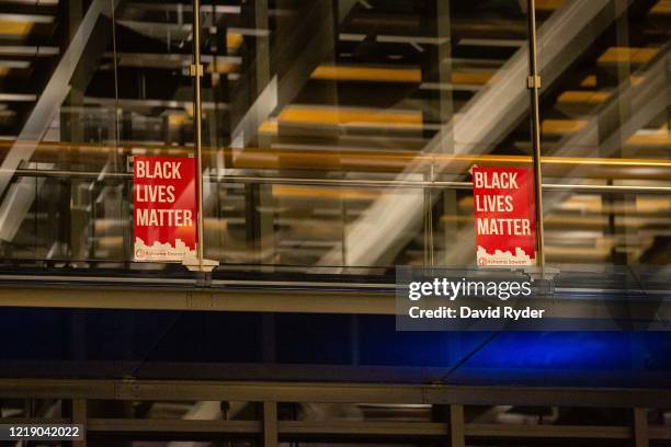 Black Lives Matter signs are seen inside Seattle City Hall after demonstrators marched inside led by Seattle City Council member Kshama Sawant on...