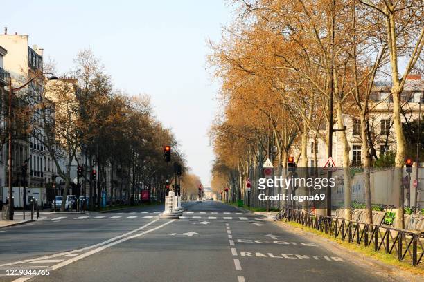 paris : empty streets during pandemic covid 19 in europe. - boulevard saint germain stock pictures, royalty-free photos & images