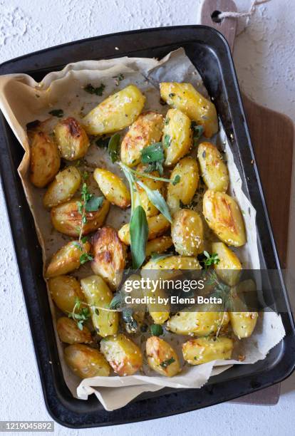 roasted potatoes - roast potatoes stock pictures, royalty-free photos & images