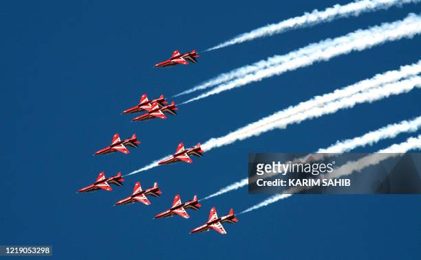 The British Royal Air Force Aerobatic Team, The Red Arrows, perform during the 2007 Dubai air show, 11 November 2007. 850 exhibitors from 50...
