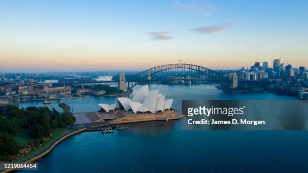 The Sydney Opera House and general harbour and cityscape during sunrise in the middle of the COVID-19 pandemic looks eerily quiet on April 10, 2020...