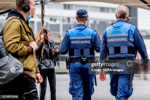 Or Special Enforcement Officers seen with a baton and pepper spray while on duty during the Coronavirus pandemic rules enforcement which consists of...