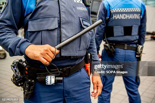 Or Special Enforcement Officers seen with a baton and pepper spray while on duty during the Coronavirus pandemic rules enforcement which consists of...