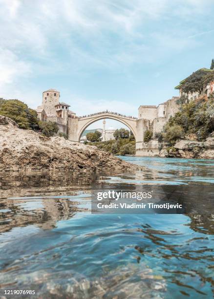 old bridge over the river in mostar - mostar stock pictures, royalty-free photos & images
