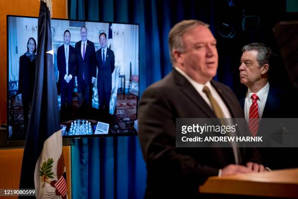An image of survivors of the 1989 Tiananmen Square protests posing for a photograph with US Secretary of State Mike Pompeo is displayed as Pompeo,...