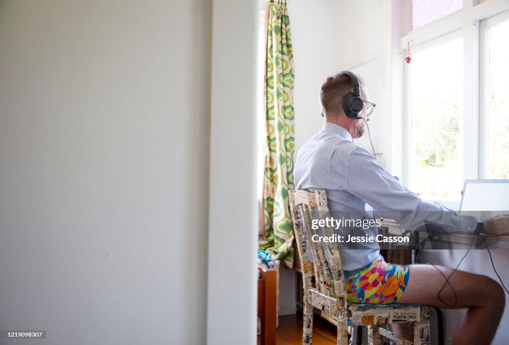 Man working from home in a makeshift office in a child's bedroom
