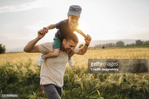 happy time together - father in field stock pictures, royalty-free photos & images
