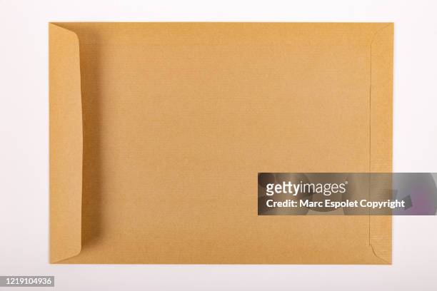 brown envelope - brown envelope stock pictures, royalty-free photos & images