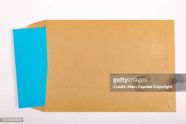 brown envelope with note - brown envelope stock pictures, royalty-free photos & images