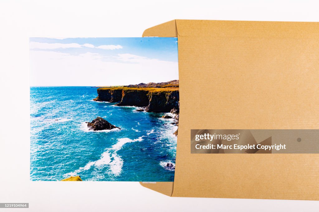 Brown envelope with landscape photo