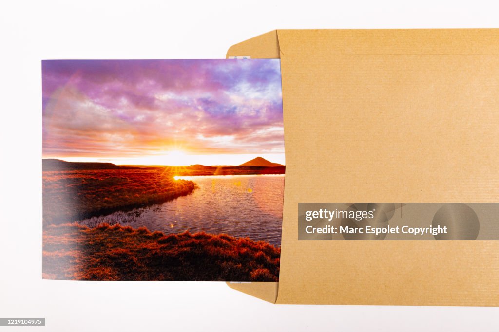 Brown envelope with landscape photo