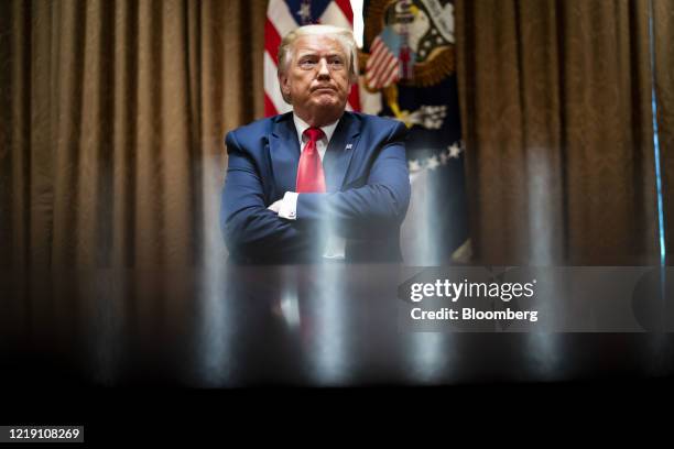 President Donald Trump sits during a meeting with African-American supporters in the Cabinet Room of the White House in Washington, D.C., U.S., on...