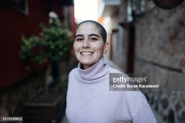 happy stylish bald woman - cancer portrait stock-fotos und bilder