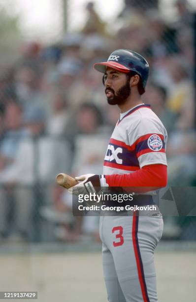Harold Baines of the Chicago White Sox looks on from the field before batting against the Pittsburgh Pirates during a Major League Baseball spring...