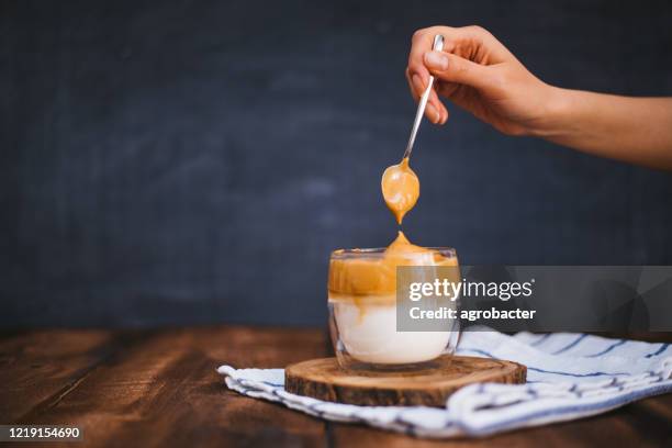 iced dalgona coffee on wooden table - sugar in glass stock pictures, royalty-free photos & images