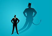 Businessman with his devil shadow