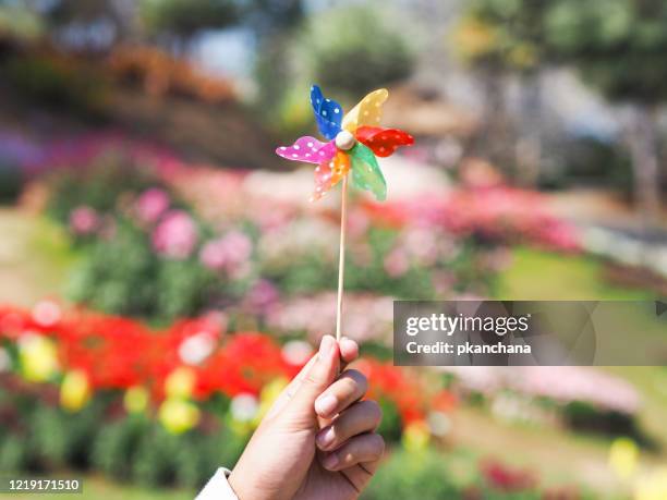 hand holding pinwheel